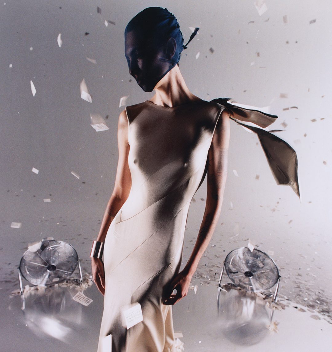 Maison Margiela Holiday 2025 campaign blends avant garde elegance with festive surrealism, showcasing metallic textures and the house’s sign