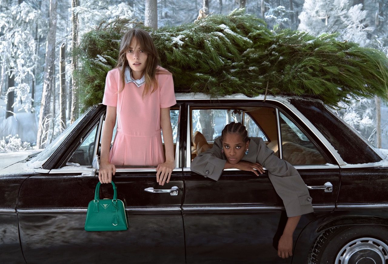 Prada Holiday 2025 campaign captures a cinematic winter journey with Maya Hawke and an ensemble cast, blending elegance, emotion, and festiv