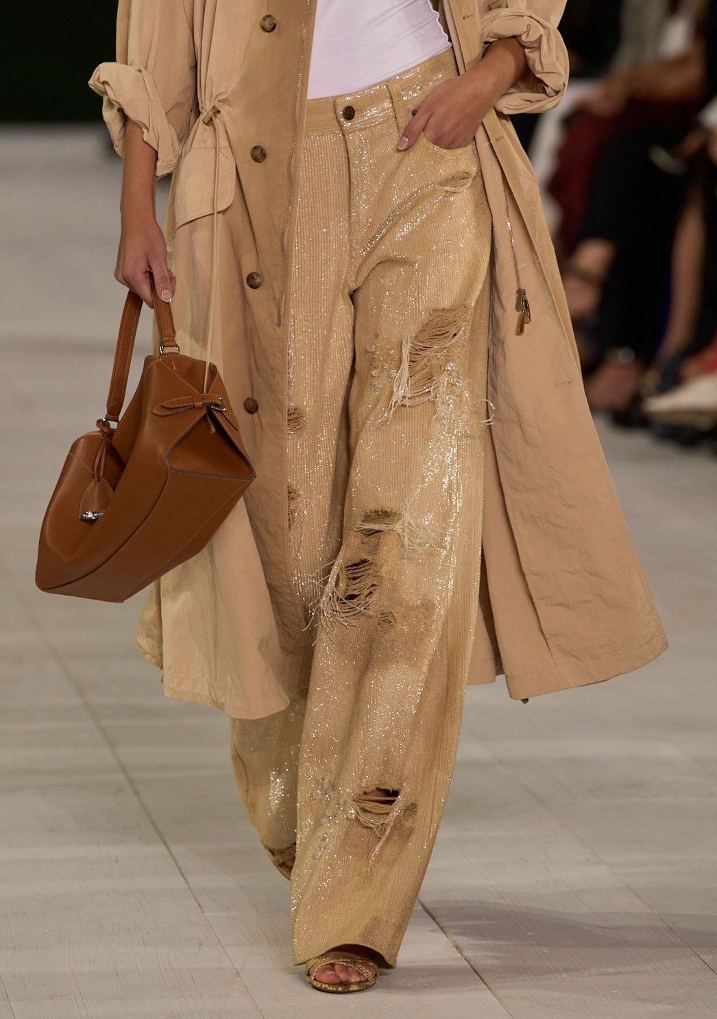 Maison Margiela Holiday 2025 campaign blends avant garde elegance with festive surrealism, showcasing metallic textures and the house’s sign