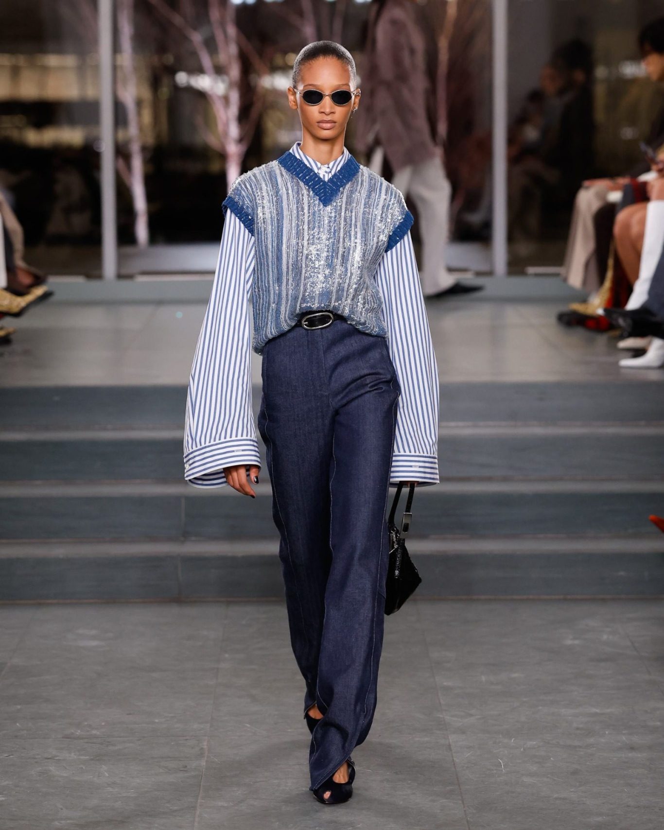 Louis Vuitton Holiday 2025 campaign Le Voyage des Lumières featuring Parisian winter scenes, luxury handbags, and soft glowing light capture